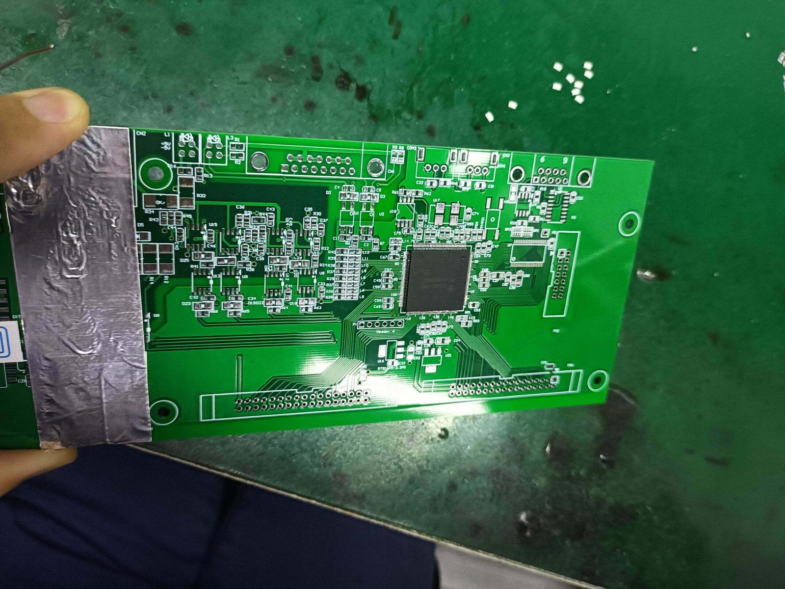 PCB Repair-Cut off excess tape in repair area