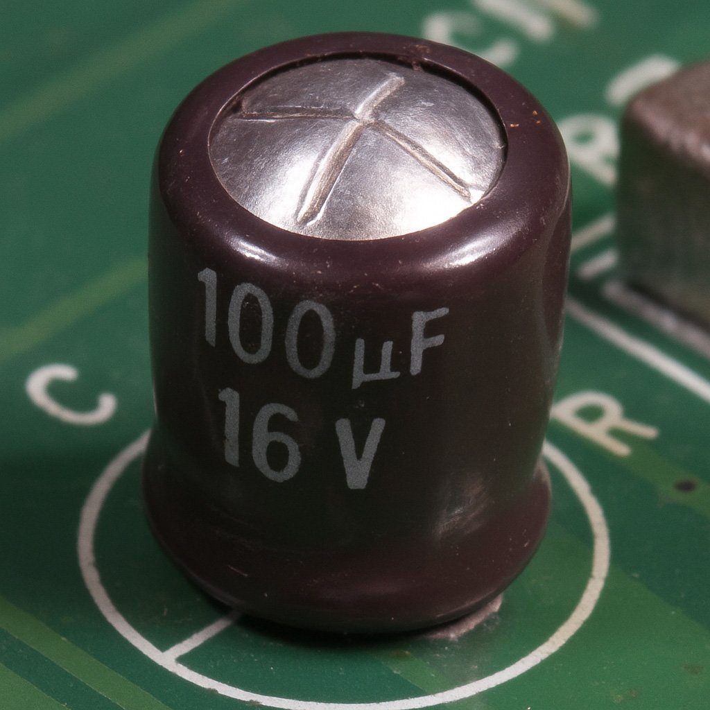 An example of a failed or failing electrolytic capacitor showing signs of expansion